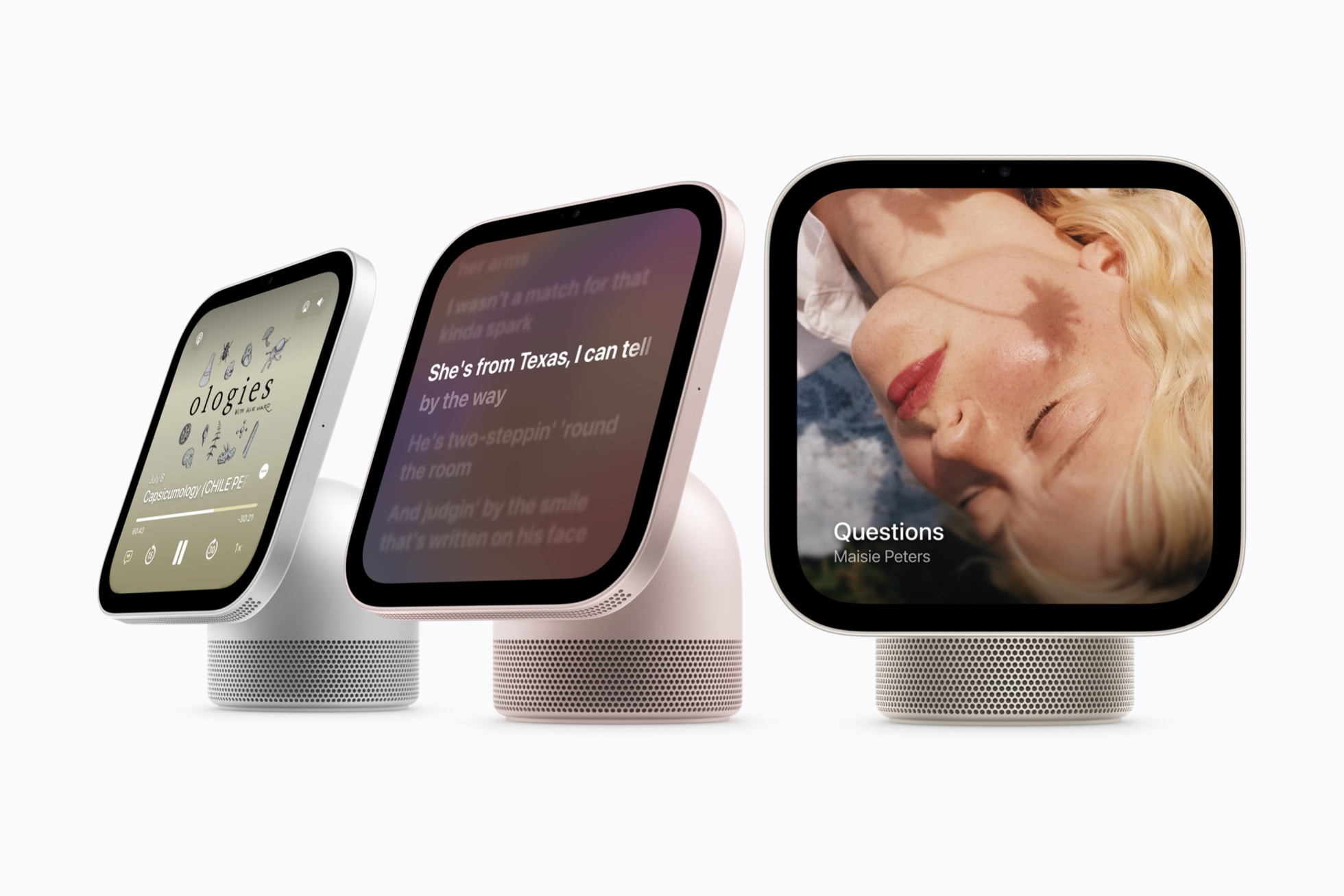 Three Apple HomeView devices displaying music and lyrics